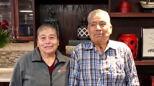 Two residents smiling in a cozy common area