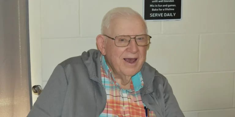 Smiling resident in a casual setting