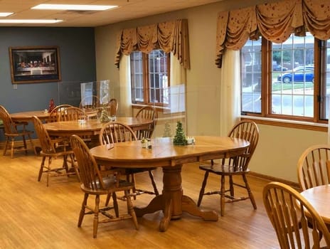 Bright dining room with wooden tables and chairs