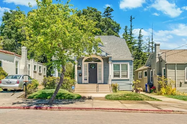 Exterior view of a senior living facility with trees