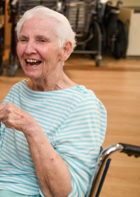 Laughing resident enjoying a social moment indoors