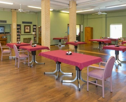 Bright common area with tables and chairs