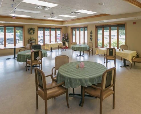 Bright dining area with tables and chairs