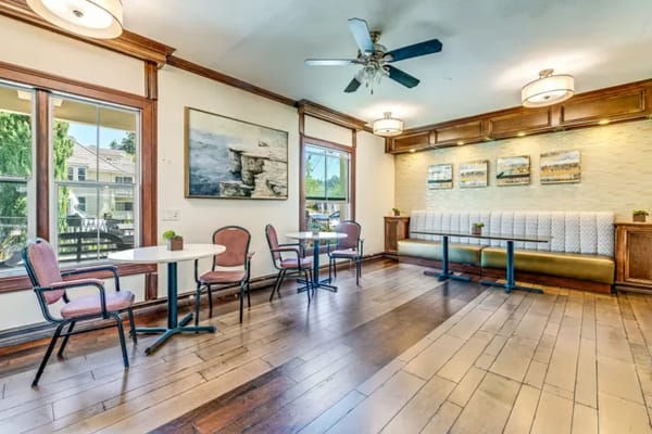 Bright common area with tables and chairs