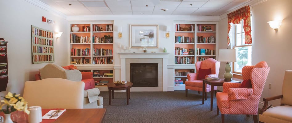 Cozy common area with bookshelves and seating