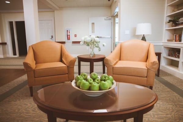 Cozy common area with chairs and a coffee table