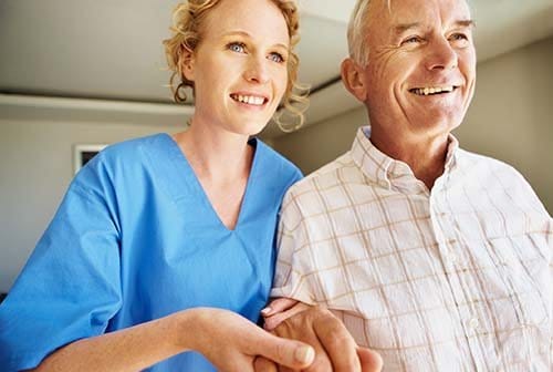 Caregiver assisting a senior resident