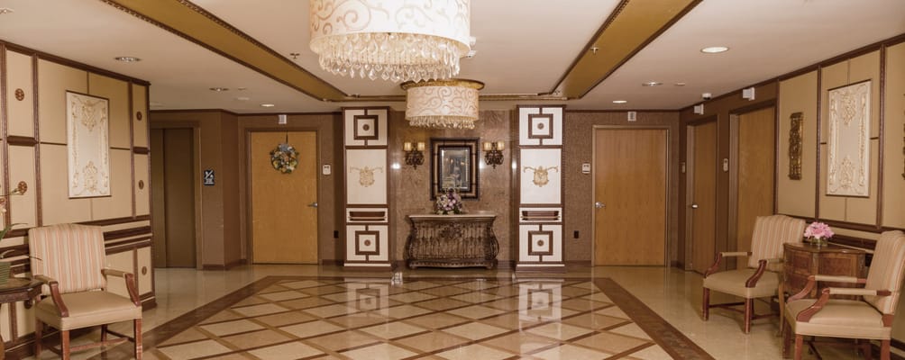 Elegant lobby with chandelier and seating area