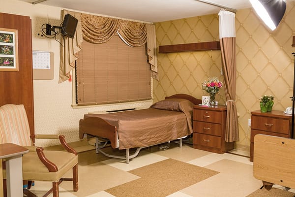Private resident room with bed and furnishings