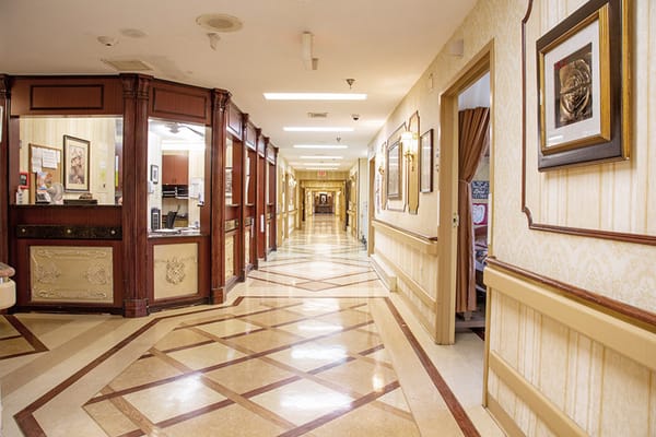 A well-lit hallway in a senior living facility