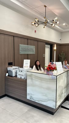 Front desk of Clover Meadows with staff and decor