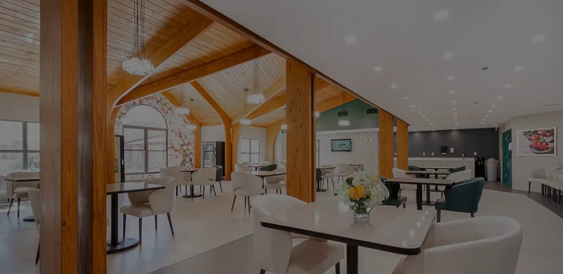 Bright dining area with wooden beams and tables