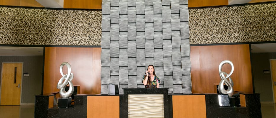 Reception area with staff member at the front desk