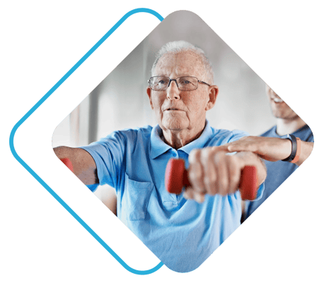 Senior man exercising with weights in a therapy session