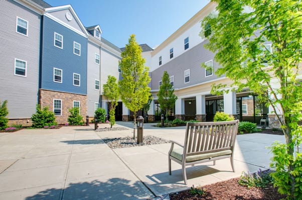 Serene outdoor courtyard with seating and greenery