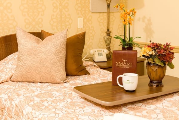 Cozy resident room with floral decor and coffee