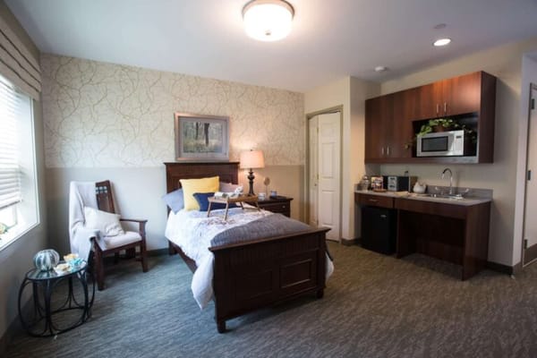 Cozy private room with a bed and kitchenette