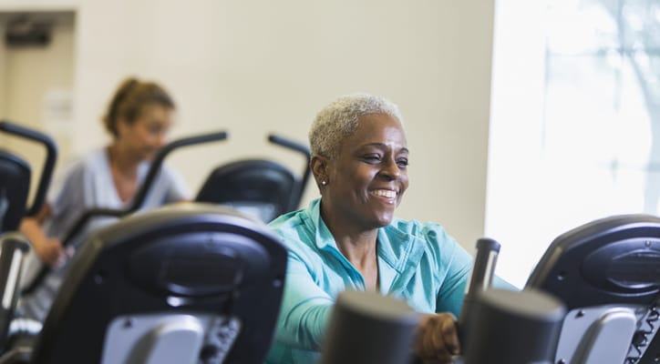 Residents exercising in a fitness area