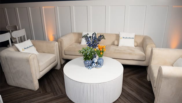 Cozy common area with comfortable seating and flowers