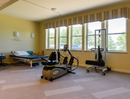 Exercise equipment in a well-lit activity room