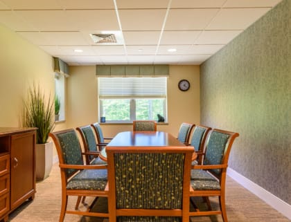 Meeting room with wooden table and chairs