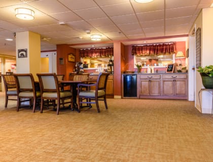 Cozy dining area with tables and kitchenette