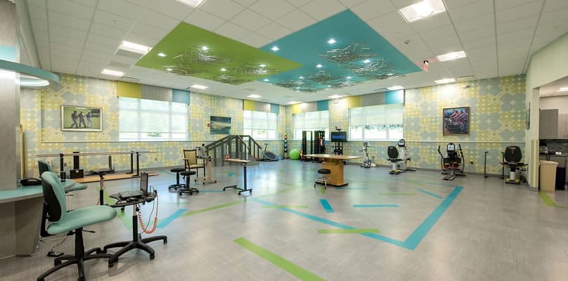 Interior view of a therapy room with exercise equipment