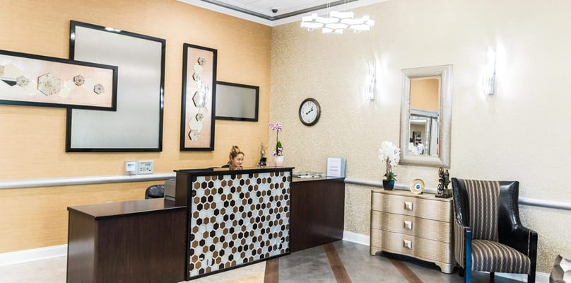 Reception area with staff member at the front desk