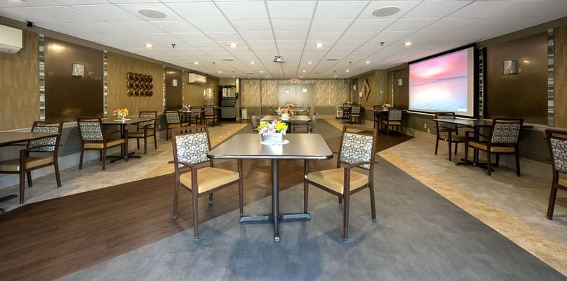 Bright and welcoming common area with tables and chairs