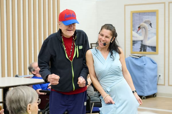 Residents enjoying a musical activity in a common area