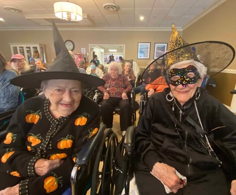 Residents enjoying a Halloween celebration in costumes