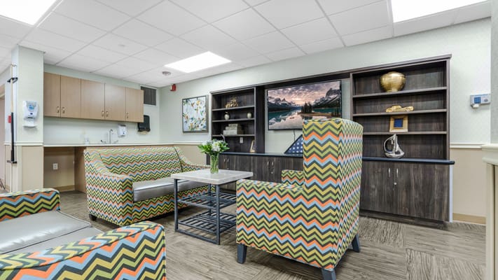 Bright common area with colorful seating and decor