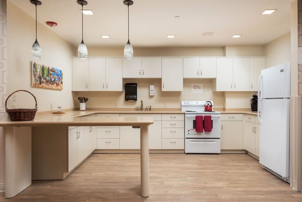 Bright kitchen area with modern appliances and cabinetry