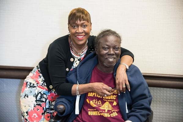 Two residents smiling together in a cozy setting