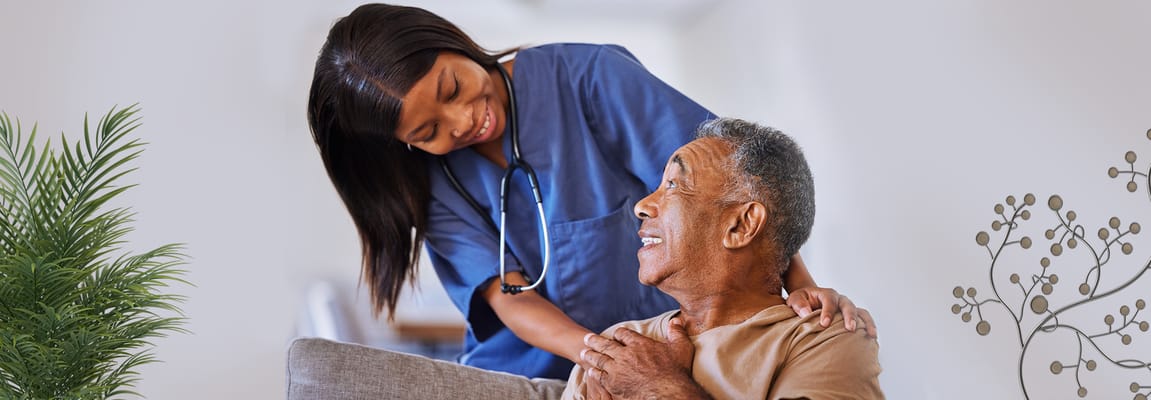 Healthcare worker assisting a senior resident indoors