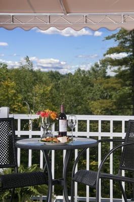 Outdoor patio setup with wine and flowers