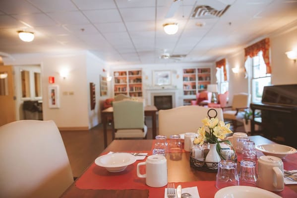 Dining area set for a meal in a common room