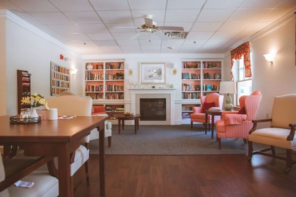 Cozy common area with bookshelves and seating