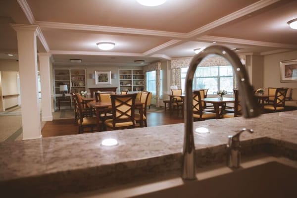 Bright common area with tables and chairs
