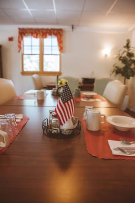 Dining room setup with an American flag centerpiece