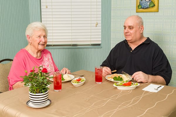 Residents enjoying a meal in the dining room