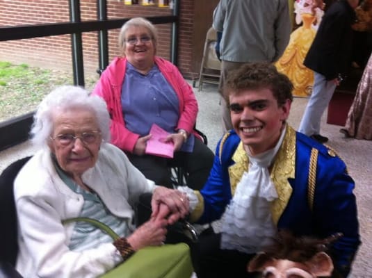 Residents enjoying a themed event with a performer