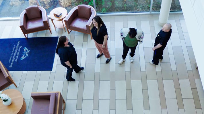 Staff interacting with residents in a common area