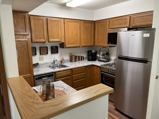 Cozy kitchen with wooden cabinets and modern appliances