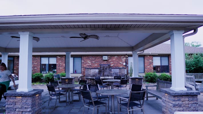 Outdoor patio area with tables and chairs