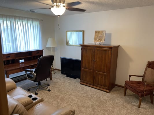 Cozy interior room with desk and seating