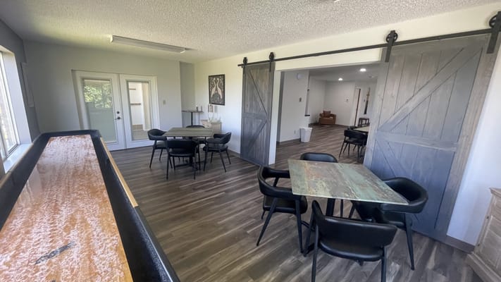 Bright common area with tables and seating
