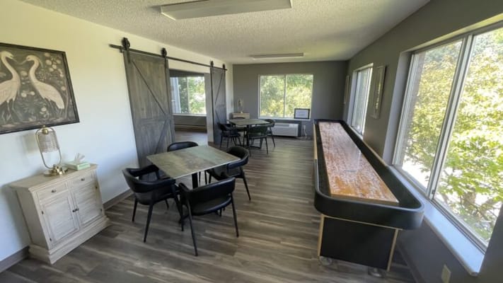 Interior common area with tables and natural light