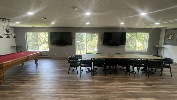 Bright common area with pool table and seating