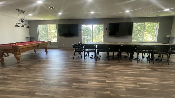 Common area with a pool table and seating